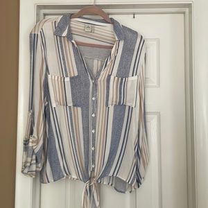 Paper crane button down and ties on the bottom of the shirt.